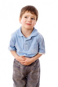 Little boy showing stomach pain, isolated on white